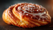 © Amir - A delectable cinnamon roll lavishly drizzled with sweet white icing and sparkling sugar crystals.