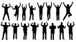 © holik - Group of diverse people celebrating with raised arms in silhouette.