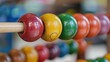 © Nany - A colorful wooden abacus with red, yellow, green, orange, and blue beads.