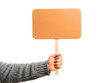 © dipu - Person holding a blank orange sign isolated on transparent background