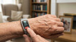 © javu - Wearable smart health alert device on elderly wrist showing SOS button and help sending message