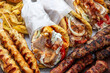 © Rawf8 - Gyro sliced meat pita bread wraps, pork skewers, and kebab, traditional greek food platter, closeup