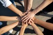 © GraphixStudio - Diverse team hands stacked together in unity shows collaboration for a shared goal, symbolizing support and teamwork success