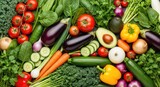 A vibrant assortment of fresh vegetables and fruits on a dark background.
