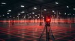 © sajibul35 - Laser scanner surveying a large empty warehouse, creating a grid of red laser lines on the floor, used for mapping and measuring the space