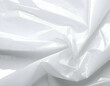 © Khaerul - Smooth, crinkled, white, shiny plastic sheeting material, flowing drape