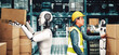 © InfiniteFlow - Innovative industry robot working in warehouse together with human worker . Concept of artificial intelligence for industrial revolution and automation manufacturing process .