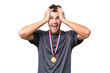 © luismolinero - Young caucasian man with medals over isolated background with surprise expression