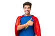 © luismolinero - Super Hero caucasian man over isolated background giving a thumbs up gesture