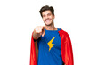 © luismolinero - Super Hero caucasian man over isolated background points finger at you with a confident expression