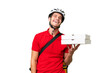 © luismolinero - Pizza delivery man with work uniform picking up pizza boxes over isolated background laughing
