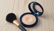 © Hi Alfan - Powder compact and makeup brush on a wooden surface, beauty product