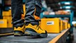 © Store - Warehouse worker in safety boots standing near a package