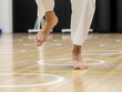 © motiva_dsgn - Woman practicing footwork exercises on wooden floor