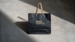 © NoorArt Studio - Luxury black handbag with gold accents and strap