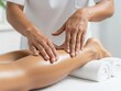© Tiana_Geo - Professional physiotherapist or masseuse giving a calf massage to a woman. Relaxation and wellness treatment at spa salon. Healthcare and physical therapy concept for advertising.