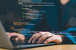© Nirusmee - Software developer coding on a laptop, representing intelligent innovation, computer programming, software engineering, system architecture, and digital data technology management.