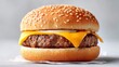 © Deepwood - Delicious cheeseburger with sesame seed bun on a white background