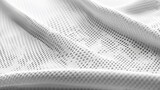 White fabric sports clothing with a football jersey air mesh texture background.