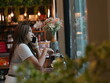© sittinan - woman relax in cafe and use smartphone