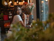 © sittinan - woman relax in cafe and use smartphone