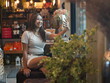© sittinan - woman relax in cafe and use smartphone