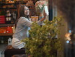 © sittinan - woman relax in cafe and use smartphone
