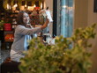 © sittinan - woman relax in cafe and use smartphone