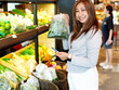 © sittinan - young woman shopping in supermarket