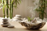 Zen Garden Arrangement with Smooth Stones Bamboo and Incense Smoke