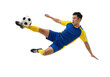 © ArsiStudio - Soccer player in blue yellow uniform kicking ball in mid air isolated