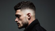 © nirwati - A modern men's hairstyle featuring a sleek fade with a textured top.