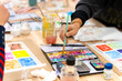 © Alfonso Soler - Student hand painting watercolor in creative art workshop