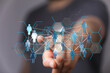 © vegefox.com - Hand touching digital network interface with human silhouettes connected by lines, representing connection and
