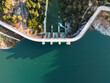 © Flash Vector - Stunning drone photo of a curved dam and reservoir in South Spain, showcasing water management, engineering, and natural landscape for environmental and infrastructure concepts.