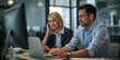 © Vitalii - Man and woman collaborating at computer in office
