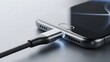 © visualdalamframe - Dynamic close-up of a sophisticated mobile computing device receiving power through a high-speed data and charging cable, showcasing modern connectivity and efficient energy replenishment