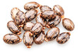 © volff - Bean-shaped, mottled, glossy castor oil seeds on white background. File contains clipping paths.