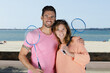 © auremar - happy couple with badminton racquet and shuttlecock