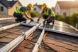 © imagemir - Two male workers installing solar panels on a roof, wearing yellow helmets and high-visibility vests.