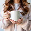 © Nusrat - Close-up of hands holding white ceramic coffee cup with pink interior, wearing soft pink sweater, bright minimal lighting, clean white background, cozy aesthetic, modern lifestyle focus.