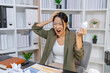 © PHOTO4U - Stressed businesswoman dealing with heavy work pressure, reacting emotionally while reviewing reports and facing tight deadlines, highlighting workplace stress and modern professional challenges.