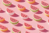 Rows of stylized watermelon slices with pink, green, & yellow rind on pink