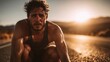 © VictorCanalesStudio - Sweaty man pausing training on a desert road under a setting sun