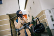© Mediteraneo - Girl puts scarf under helmet while riding scooter