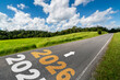 © InfiniteFlow - 2026 New Year road trip travel and future vision concept . Nature landscape with highway road leading forward to happy new year celebration in the beginning of 2026 for glee and successful start .