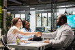 © DC Studio - Handshake between HR manager and candidate for filling in the new position, legal terms and paperwork completed as the new employee prepares to join the team and start a successful career.
