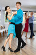© JackF - Woman paired with male partner dance samba in class with students
