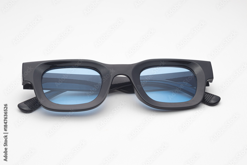 Trendy Black Rectangular Sunglasses with Blue Tinted Lenses Isolated on White Background