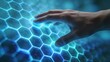 © Worldwide - Futuristic hand interacting with glowing hexagonal interface.